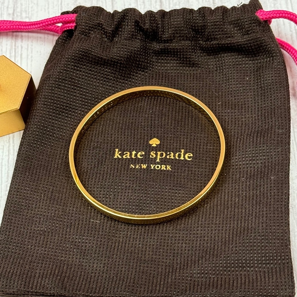 Kate Spade Gold Tone Bangle Engraved with “heart of gold”